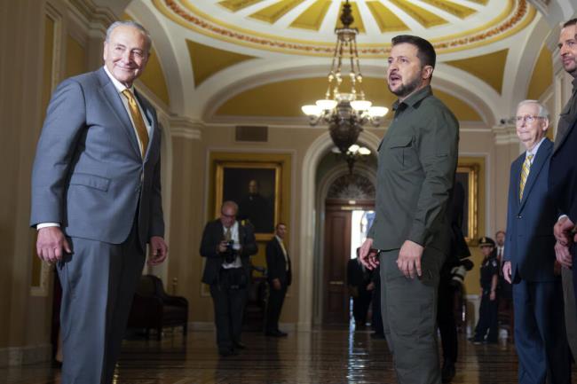 Senate Majority Leader Chuck Schumer of N.Y., left, and Senate Minority Leader Mitch McCo<em></em>nnell of Ky., right, listen as Ukrainian President Volodymyr Zelenskyy, second from left, speaks while walking through Capitol Hill on Thursday, Sept. 21, 2023, in Washington. (AP Photo/Mark Schiefelbein)