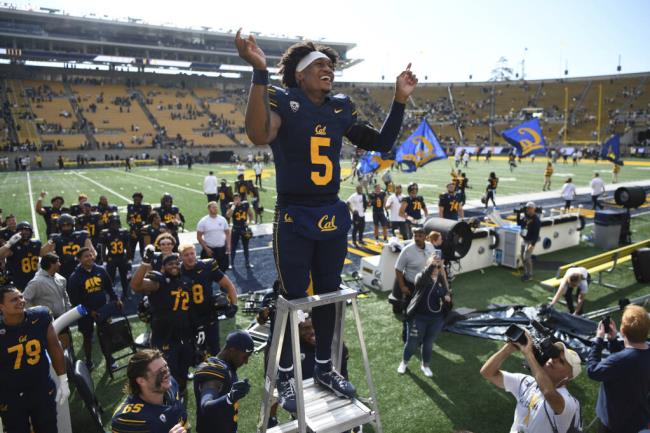 California quarterback Sam Jackson V smiles as he direct the Cal marching band after the team's win over Idaho in an NCAA college football game in Berkeley, Calif., Saturday, Sept. 16, 2023. (Jose Fajardo/Bay Area News Group via AP)