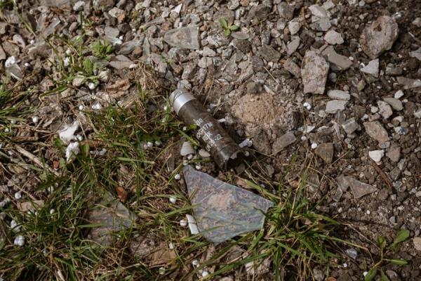 AVDIIVKA, UKRAINE - MARCH 23: Cluster bomb capluse is seen on the ground amid Russia-Ukraine war at the fro<em></em>ntline city of Avdiivka, Ukraine on March 23, 2023. Around 2000 people are left in the town and volunteers enter the town daily although the war continues. (Photo by Andre Luis Alves/Anadolu Agency via Getty Images)