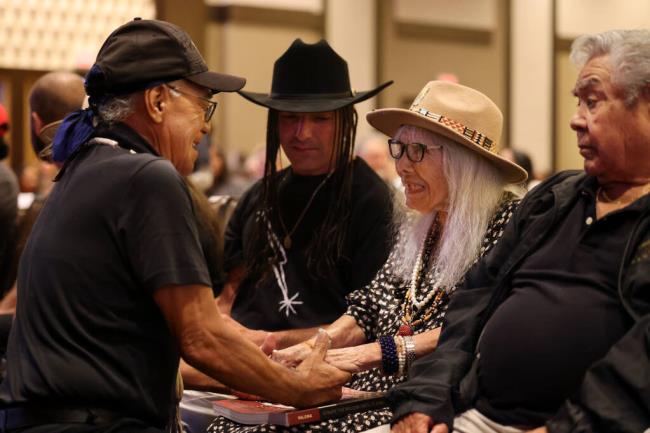 Julia Parker, 95, a Coast Miwok-Kashaya Pomo, who attended an Indian boarding school in her youth, greets an old friend James Brown of the Elem Indian co<em></em>lony of Pomo Indians, during a listening session for Indian boarding school survivors and their descendants at Graton Resort & Casino in Rohnert Park, Sunday, August 6, 2023. The tour is part of the Federal Indian Boarding School Initiative, an effort to recognize the troubled legacy of federal Indian boarding schools.  (Beth Schlanker / The Press Democrat)